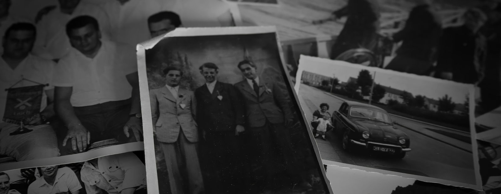 Old black and white photographs of family groups, loose and overlapping