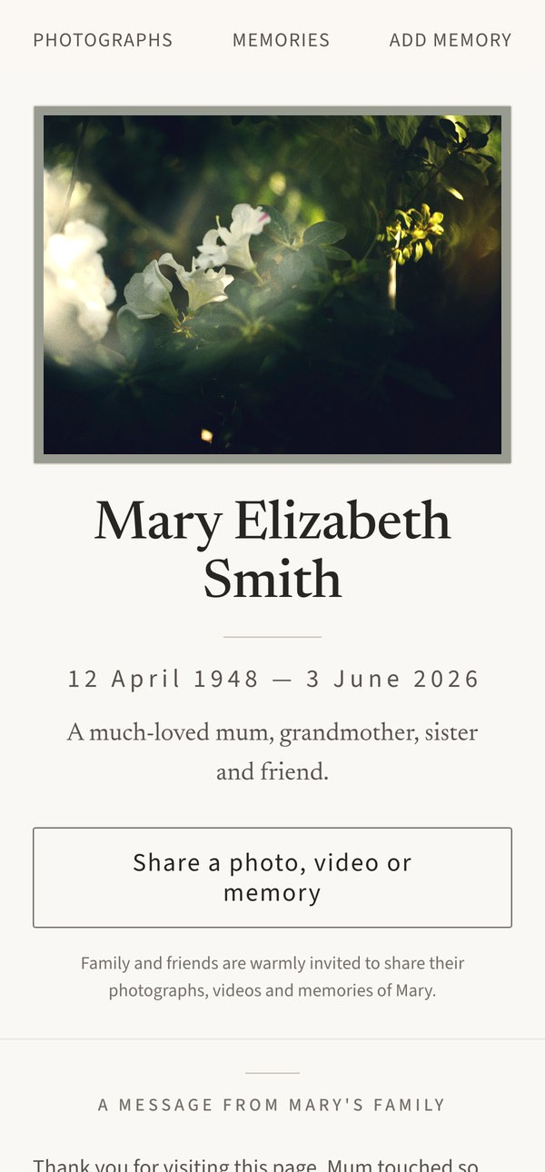A memorial page on a phone, showing a photograph, the person's name and dates, and a button to share a memory